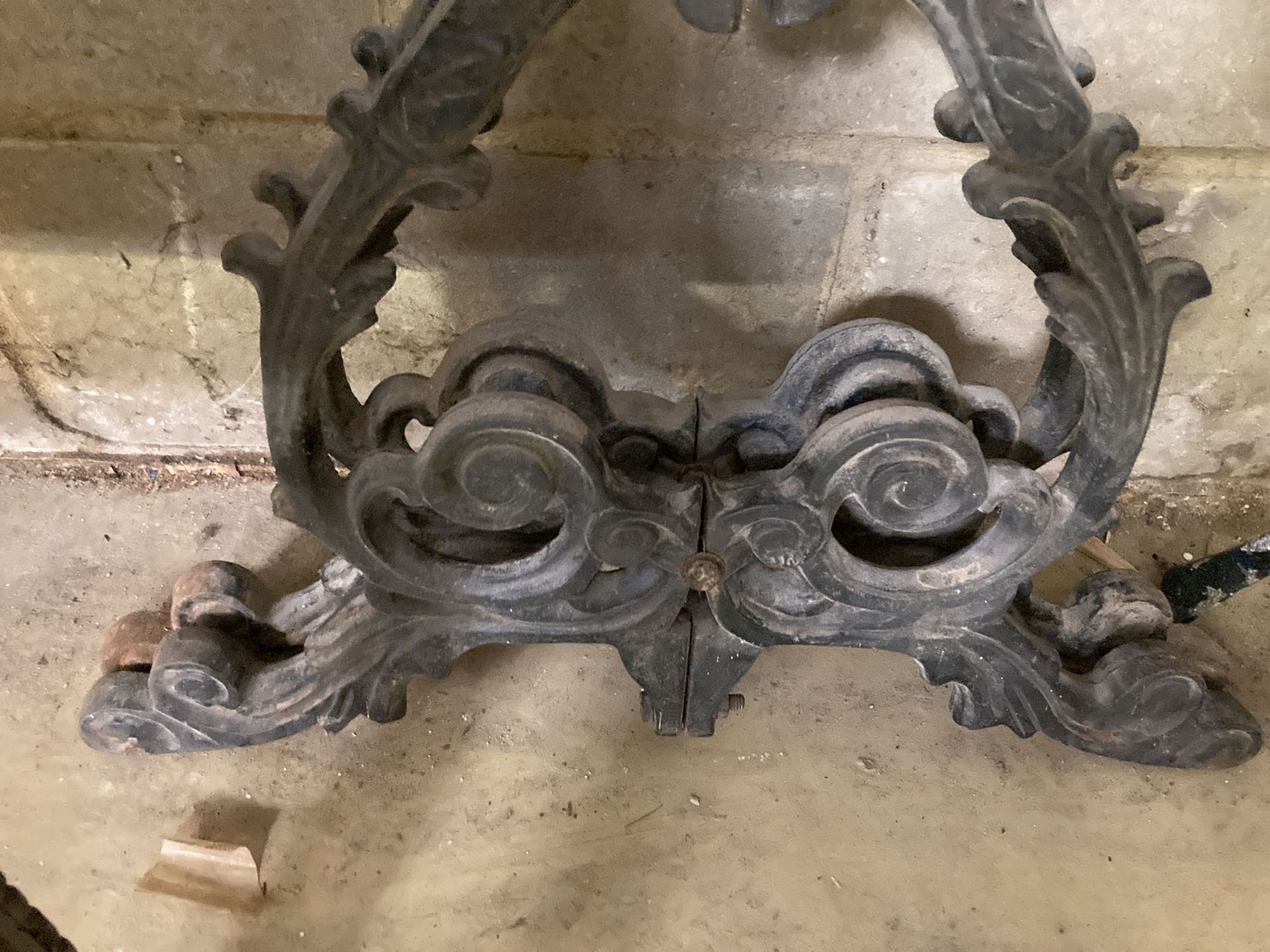 A pair of Victorian style cast iron table supports, width 54cm, height 68cm